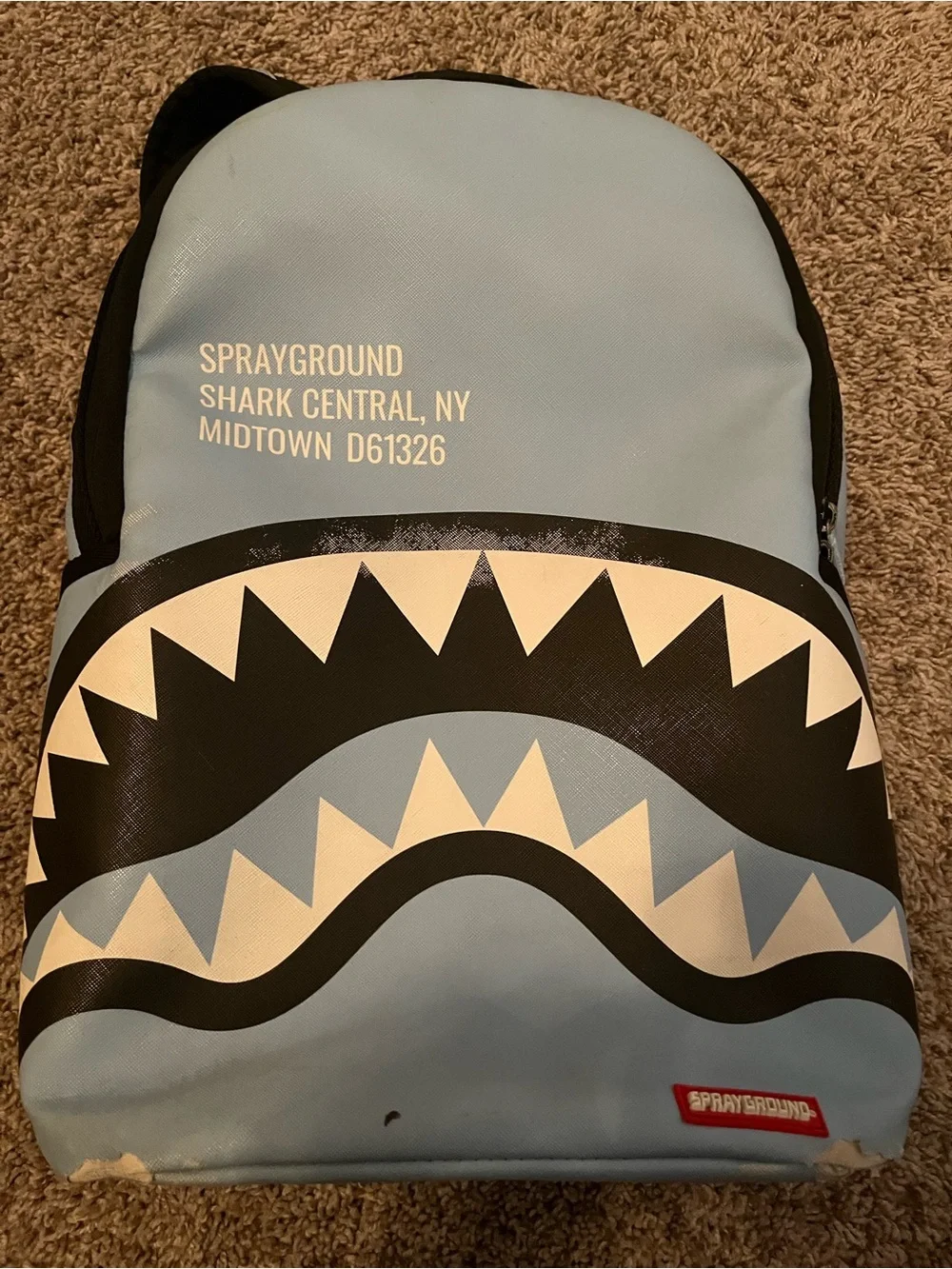 Sprayground Light Blue Backpack.